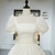 Close-up of structured square neckline on an organza ball gown wedding dress.