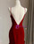 Figure-hugging mermaid silhouette on burgundy halter formal dress