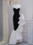 Black and white mermaid prom dress with sequin bodice and white ruffle skirt
