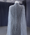 Silver-gray beaded evening gown with flowing tulle cape