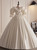 Puff sleeve satin ball gown wedding dress with lace bodice front view