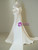 The sculptural flare of a satin mermaid gown, where pleats meet floor-length elegance