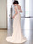 Curve-hugging mermaid silhouette satin wedding dress showcasing the dramatic flare.