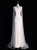 White mermaid wedding dress with a high neck, long sleeves, and crystal embellishments, a celestial choice for an evening ceremony