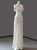 Ivory satin off-shoulder wedding dress with pleated A-line skirt front view
