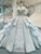 Off-shoulder ball gown wedding dress with beaded lace and tulle skirt