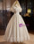Cape-style lace overlay on off-shoulder satin wedding gown