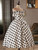 Pleated A-line skirt on white satin off-shoulder wedding gown