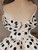 Lace-up back closure on white satin wave point wedding dress