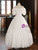 Elegant satin wedding gown with lace-up back and bow embellishment