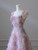 Close-up of delicate 3D floral embellishments on pink tulle gown