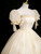 Champagne Tulle Sequins Puff Sleeve Quinceanera Dress