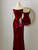 Close-up of sparkling sequin details on burgundy evening gown