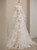 Off the shoulder white tulle prom dress with floral appliqués and long sleeves