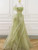 Off-the-shoulder sleeves with lace trim on green gown