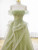 Beading and lace details on green prom dress bodice