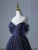 Close-up of intricate beadwork and sequins on blue gradient tulle prom dress