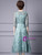 Zipper-up back of a short sleeve green formal dress with appliques
