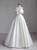 Stunning strapless A-line wedding dress with an oversized satin bow at the waist.