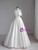 Flattering A-line silhouette wedding dress with a dramatic bow detail.