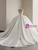 Zipper back closure on white satin strapless wedding gown