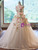 Layered soft tulle skirt on a 3D floral applique ball gown wedding dress