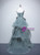 Lace-up back closure on green tulle spaghetti strap prom dress with built-in bra