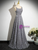 Side view of gray sequin A-line prom dress with floor-length hem