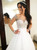 Sheer Back Pearls Puffy Wedding Dress with Long Sleeves