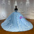 Voluminous blue tulle skirt decorated with floral details