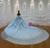 Lace-up corset back of blue tulle princess ball gown with intricate beading
