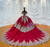 The off-shoulder neckline and appliques in shadow lighting, showing depth and texture