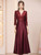 Burgundy satin sequin short sleeve mother of the bride dress with a flattering A-line silhouette