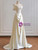 Flowing A-line skirt on an ivory satin wedding gown.