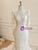 Elegant long lace sleeves on a form-fitting mermaid wedding gown