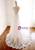 	Close-up of delicate appliqués on white tulle wedding dress bodice