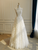 Lace A-line wedding dress with delicate straps and full floor-length skirt