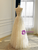 Back view of a lace wedding dress with lace-up back closure and A-line silhouette