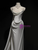 Side view of curve-hugging mermaid silhouette wedding dress showing the dramatic flare at the knee