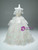 Lace-up corset back of a white tiered prom dress for adjustable fit