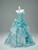Blue strapless prom dress with floral appliqués and pleated skirt