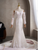 	White mermaid lace long sleeve beading wedding dress – front view with fitted bodice and flared skirt