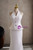 White V-neck wedding dress showing sculpted waist and mermaid skirt