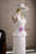 Side view of white mermaid wedding dress with sleek floor length skirt