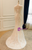  Side/back view of the mermaid wedding dress showing the sweep train and lace details.