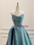 Close-up detail of the ruched pleated bodice and sweetheart neckline.