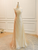  Front view of the gold strapless two-piece A-line prom dress.