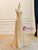  Front view of the gold strapless two-piece A-line prom dress.