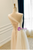  Close-up detail of the delicate diagonal pleating and subtle beading on the single strap.