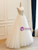 Romantic full front view of the soft tulle A-line bridal gown.